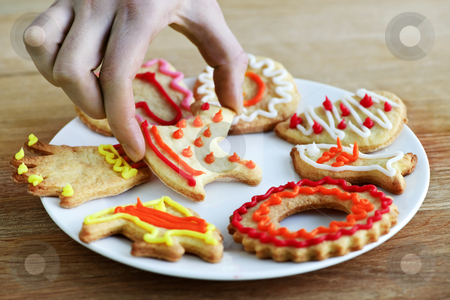 To use this stock image in your creative project, please select the size you need over to the right and click the "Add to Cart" button.
Your downloaded image will come with the Cutcaster watermark removed so don’t worry about the watermark you see on this page. Plate of homemade cookies stock photo, Hand taking cookie from plate of homemade shortbread cookies with icing by Elena Elisseeva