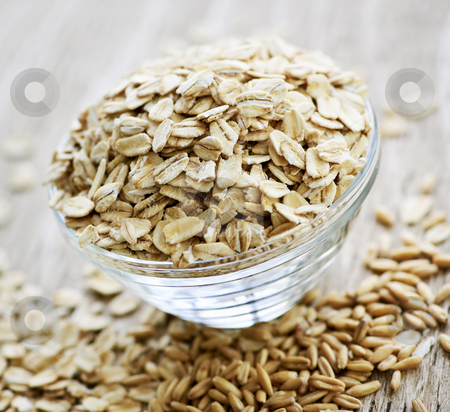 To use this stock image in your creative project, please select the size you need over to the right and click the "Add to Cart" button.
Your downloaded image will come with the Cutcaster watermark removed so don’t worry about the watermark you see on this page. Bowl of uncooked rolled oats stock photo, Nutritious rolled oats heaped in a glass bowl by Elena Elisseeva