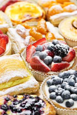 To use this stock image in your creative project, please select the size you need over to the right and click the "Add to Cart" button.
Your downloaded image will come with the Cutcaster watermark removed so don’t worry about the watermark you see on this page. Assorted tarts and pastries stock photo, Background of assorted fresh sweet tarts and pastries by Elena Elisseeva