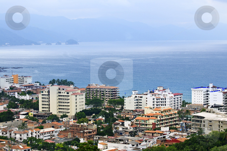 To use this stock image in your creative project, please select the size you need over to the right and click the "Add to Cart" button.
Your downloaded image will come with the Cutcaster watermark removed so don’t worry about the watermark you see on this page. Cityscape in Puerto Vallarta, Mexico stock photo, Cityscape view from above with Pacific ocean in Puerto Vallarta, Mexico by Elena Elisseeva
