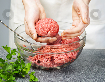 To use this stock image in your creative project, please select the size you need over to the right and click the "Add to Cart" button.
Your downloaded image will come with the Cutcaster watermark removed so don’t worry about the watermark you see on this page. Cooking with ground beef stock photo, Chef making hamburgers in kitchen with ground beef by Elena Elisseeva