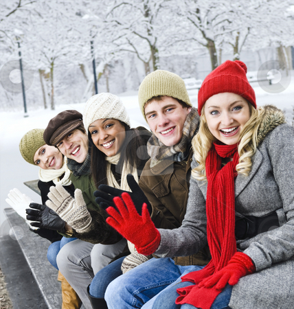 To use this stock image in your creative project, please select the size you need over to the right and click the "Add to Cart" button.
Your downloaded image will come with the Cutcaster watermark removed so don’t worry about the watermark you see on this page. Group of friends outside in winter stock photo, Group of diverse young friends waving hello outdoors in winter by Elena Elisseeva