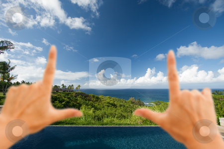 To use this stock image in your creative project, please select the size you need over to the right and click the "Add to Cart" button.
Your downloaded image will come with the Cutcaster watermark removed so don’t worry about the watermark you see on this page. Hands Framing Breathtaking Hawaiian Ocean View Deck and Pool stock photo, Hands Framing Breathtaking Hawaiian Ocean View Deck and Pool with Deep Blue Sky by Andy Dean