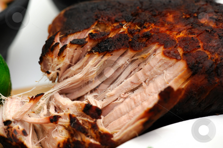 To use this stock image in your creative project, please select the size you need over to the right and click the "Add to Cart" button.
Your downloaded image will come with the Cutcaster watermark removed so don’t worry about the watermark you see on this page. Close-up Of Mexican Pork Carnitas stock photo, A browned pork roast pulled apart cooked in the Mexican style for the dish known as carnitas by Lynn Bendickson