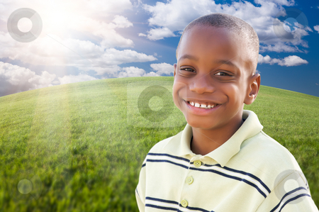 To use this stock image in your creative project, please select the size you need over to the right and click the "Add to Cart" button.
Your downloaded image will come with the Cutcaster watermark removed so don’t worry about the watermark you see on this page. Handsome African American Boy Over Grass and Sky stock photo, Handsome African American Boy Over Clouds, Sky and Arched Horizon of Grass Field. by Andy Dean