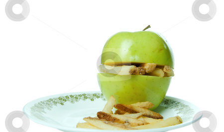 To use this stock image in your creative project, please select the size you need over to the right and click the "Add to Cart" button.
Your downloaded image will come with the Cutcaster watermark removed so don’t worry about the watermark you see on this page. Unhealthy Eating stock photo, Concept image of unhealthy eating with an apple making a sandwich of french fries. by Richard Nelson