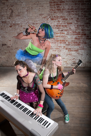 To use this stock image in your creative project, please select the size you need over to the right and click the "Add to Cart" button.
Your downloaded image will come with the Cutcaster watermark removed so don’t worry about the watermark you see on this page. Female punk rock band stock photo, Young all girl punk rock band performing by Scott Griessel