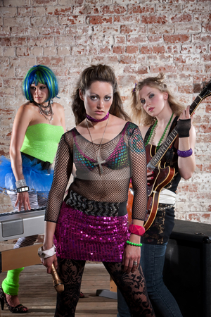 To use this stock image in your creative project, please select the size you need over to the right and click the "Add to Cart" button.
Your downloaded image will come with the Cutcaster watermark removed so don’t worry about the watermark you see on this page. Female punk rock band stock photo, Young all girl punk rock band performs in a warehouse by Scott Griessel