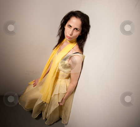 To use this stock image in your creative project, please select the size you need over to the right and click the "Add to Cart" button.
Your downloaded image will come with the Cutcaster watermark removed so don’t worry about the watermark you see on this page. Serious looking woman in a yellow dress stock photo, High angle view of a woman in a yellow dress. She has a serious expression on her face. by Scott Griessel