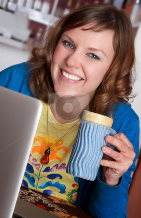 To use this stock image in your creative project, please select the size you need over to the right and click the "Add to Cart" button.
Your downloaded image will come with the Cutcaster watermark removed so don’t worry about the watermark you see on this page. Smiling lady in cafe stock photo, Smiling lady in cafe with laptop and mug by Scott Griessel
