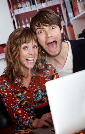 To use this stock image in your creative project, please select the size you need over to the right and click the "Add to Cart" button.
Your downloaded image will come with the Cutcaster watermark removed so don’t worry about the watermark you see on this page. Happy young couple stock photo, Overjoyed young couple browsing the internet at a cafe by Scott Griessel