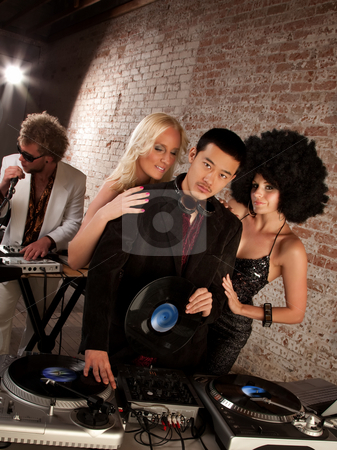 To use this stock image in your creative project, please select the size you need over to the right and click the "Add to Cart" button.
Your downloaded image will come with the Cutcaster watermark removed so don’t worry about the watermark you see on this page. Handsome Asian DJ at a 1970s Disco Music Party stock photo, Handsome Asian DJ at a 1970s Disco Music Party by Scott Griessel