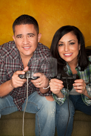 To use this stock image in your creative project, please select the size you need over to the right and click the "Add to Cart" button.
Your downloaded image will come with the Cutcaster watermark removed so don’t worry about the watermark you see on this page. Hispanic Couple Playing Video game stock photo, Attractive Hispanic Couple Playing a Video Game with Handheld Controllers by Scott Griessel