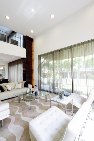 To use this stock image in your creative project, please select the size you need over to the right and click the "Add to Cart" button.
Your downloaded image will come with the Cutcaster watermark removed so don’t worry about the watermark you see on this page. Living room stock photo, Interior view of a modern living room by Adrin Shamsudin