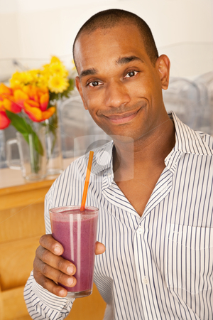 To use this stock image in your creative project, please select the size you need over to the right and click the "Add to Cart" button.
Your downloaded image will come with the Cutcaster watermark removed so don’t worry about the watermark you see on this page. Man Holding a Smoothie stock photo, Man is holding a smoothie while smiling at the camera. Vertical shot. by Scott Griessel