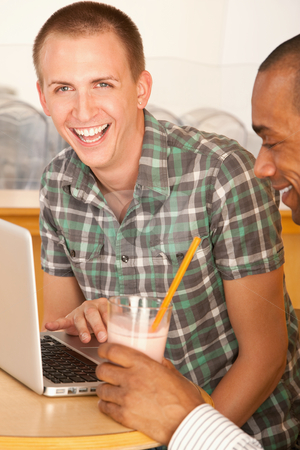 To use this stock image in your creative project, please select the size you need over to the right and click the "Add to Cart" button.
Your downloaded image will come with the Cutcaster watermark removed so don’t worry about the watermark you see on this page. Men on a Laptop stock photo, Two men are working on a laptop and smiling. One of the men is looking towards the camera. Vertical shot. by Scott Griessel