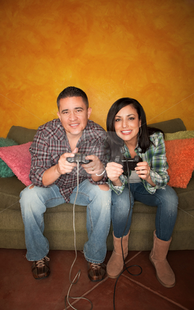 To use this stock image in your creative project, please select the size you need over to the right and click the "Add to Cart" button.
Your downloaded image will come with the Cutcaster watermark removed so don’t worry about the watermark you see on this page. Hispanic Couple Playing Video game stock photo, Attractive Hispanic Couple Playing a Video Game with Handheld Controllers by Scott Griessel