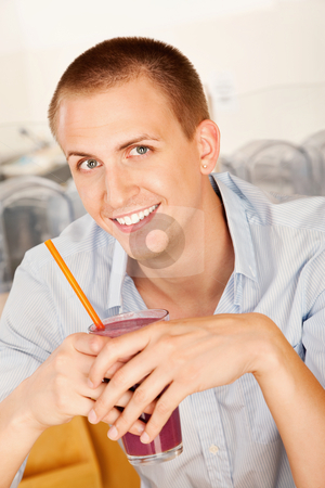To use this stock image in your creative project, please select the size you need over to the right and click the "Add to Cart" button.
Your downloaded image will come with the Cutcaster watermark removed so don’t worry about the watermark you see on this page. Young Man Drinking a Smoothie stock photo, A young man holding a frozen beverage. Vertical shot. by Scott Griessel