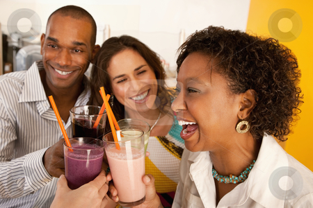 To use this stock image in your creative project, please select the size you need over to the right and click the "Add to Cart" button.
Your downloaded image will come with the Cutcaster watermark removed so don’t worry about the watermark you see on this page. Two Couples Dining Out stock photo, Two couples at a cafe drinking frozen beverages. Horizontal shot. by Scott Griessel
