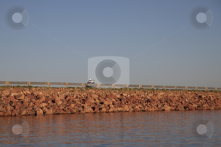 To use this stock image in your creative project, please select the size you need over to the right and click the "Add to Cart" button.
Your downloaded image will come with the Cutcaster watermark removed so don’t worry about the watermark you see on this page. Highway on lake dam stock photo, Rock lake dam with highway and motorcycle in sunset light by Marek Uliasz
