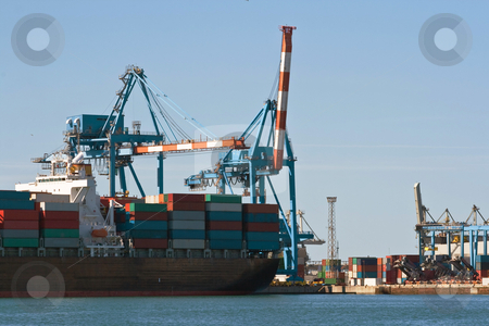 To use this stock image in your creative project, please select the size you need over to the right and click the "Add to Cart" button.
Your downloaded image will come with the Cutcaster watermark removed so don’t worry about the watermark you see on this page. Container ship in harbor stock photo, Detail of container ship in Genova harbor by ANTONIO SCARPI