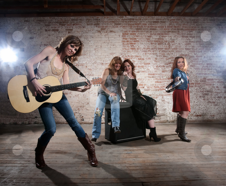 To use this stock image in your creative project, please select the size you need over to the right and click the "Add to Cart" button.
Your downloaded image will come with the Cutcaster watermark removed so don’t worry about the watermark you see on this page. Female musicians stock photo, All girl band practicing before a big performance by Scott Griessel