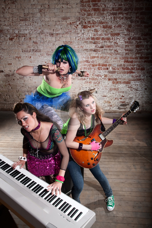 To use this stock image in your creative project, please select the size you need over to the right and click the "Add to Cart" button.
Your downloaded image will come with the Cutcaster watermark removed so don’t worry about the watermark you see on this page. Female punk rock band stock photo, Young all girl punk rock band performing by Scott Griessel