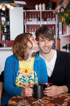 To use this stock image in your creative project, please select the size you need over to the right and click the "Add to Cart" button.
Your downloaded image will come with the Cutcaster watermark removed so don’t worry about the watermark you see on this page. Happy couple stock photo, Love and kisses with coffee at a cafe by Scott Griessel