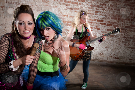 To use this stock image in your creative project, please select the size you need over to the right and click the "Add to Cart" button.
Your downloaded image will come with the Cutcaster watermark removed so don’t worry about the watermark you see on this page. Female punk rock band stock photo, Young all girl punk rock band performing by Scott Griessel