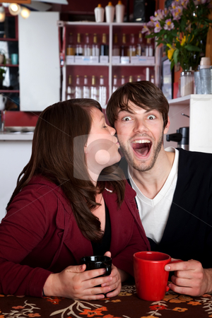 To use this stock image in your creative project, please select the size you need over to the right and click the "Add to Cart" button.
Your downloaded image will come with the Cutcaster watermark removed so don’t worry about the watermark you see on this page. Surprise Kiss stock photo, Well deserved kiss in a coffee shop by Scott Griessel