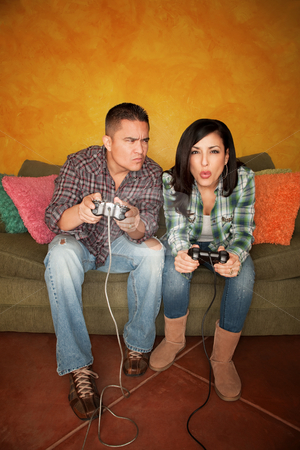 To use this stock image in your creative project, please select the size you need over to the right and click the "Add to Cart" button.
Your downloaded image will come with the Cutcaster watermark removed so don’t worry about the watermark you see on this page. Hispanic Couple Playing Video game stock photo, Attractive Hispanic Couple Playing a Video Game with Handheld Controllers by Scott Griessel