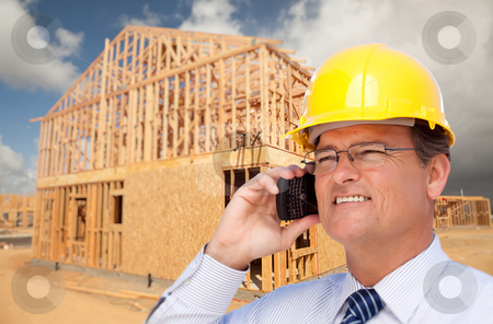 To use this stock image in your creative project, please select the size you need over to the right and click the "Add to Cart" button.
Your downloaded image will come with the Cutcaster watermark removed so don’t worry about the watermark you see on this page. Contractor in Hardhat at Construction Site stock photo, Contractor in Hardhat at Construction Site Talks on His Cell Phone. by Andy Dean