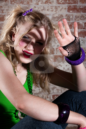 To use this stock image in your creative project, please select the size you need over to the right and click the "Add to Cart" button.
Your downloaded image will come with the Cutcaster watermark removed so don’t worry about the watermark you see on this page. Young Punk Rocker stock photo, Young punk rocker shielding her face from the light by Scott Griessel
