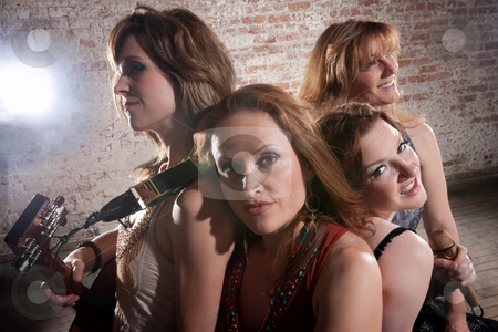 To use this stock image in your creative project, please select the size you need over to the right and click the "Add to Cart" button.
Your downloaded image will come with the Cutcaster watermark removed so don’t worry about the watermark you see on this page. Female musicians stock photo, Female musicians rest after a long practice session by Scott Griessel