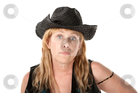 To use this stock image in your creative project, please select the size you need over to the right and click the "Add to Cart" button.
Your downloaded image will come with the Cutcaster watermark removed so don’t worry about the watermark you see on this page. Woman in western wear stock photo, Indifferent middle-aged woman with black cowboy hat by Scott Griessel