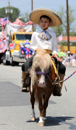 To use this stock image in your creative project, please select the size you need over to the right and click the "Add to Cart" button.
Your downloaded image will come with the Cutcaster watermark removed so don’t worry about the watermark you see on this page. Ojai 4th of July Parade 2010 stock photo, Ojai, CA - JULY 3 : Annual 4th of July parade in Ojai one day early this year July 3, 2010 in Ojai, CA. by Henrik Lehnerer