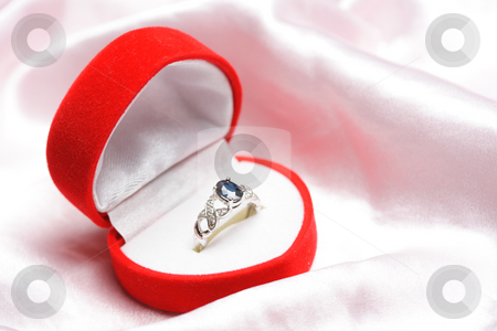 To use this stock image in your creative project, please select the size you need over to the right and click the "Add to Cart" button.
Your downloaded image will come with the Cutcaster watermark removed so don’t worry about the watermark you see on this page. Diamond ring stock photo, A diamond sapphire ring in a jewelry box by Suprijono Suharjoto