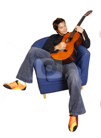 To use this stock image in your creative project, please select the size you need over to the right and click the "Add to Cart" button.
Your downloaded image will come with the Cutcaster watermark removed so don’t worry about the watermark you see on this page. Guitar player stock photo, Young man playing guitar (isolated) by Suprijono Suharjoto