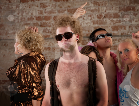 To use this stock image in your creative project, please select the size you need over to the right and click the "Add to Cart" button.
Your downloaded image will come with the Cutcaster watermark removed so don’t worry about the watermark you see on this page. Bare chested man at disco party stock photo, Disco pose with friends at a 1970s Disco Music Party by Scott Griessel