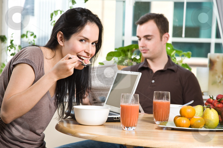 To use this stock image in your creative project, please select the size you need over to the right and click the "Add to Cart" button.
Your downloaded image will come with the Cutcaster watermark removed so don’t worry about the watermark you see on this page. Couple eating breakfast stock photo, A shot of a couple eating their breakfast at home by Suprijono Suharjoto