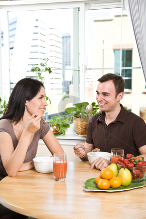 To use this stock image in your creative project, please select the size you need over to the right and click the "Add to Cart" button.
Your downloaded image will come with the Cutcaster watermark removed so don’t worry about the watermark you see on this page. Couple eating breakfast stock photo, A shot of a couple eating their breakfast at home by Suprijono Suharjoto