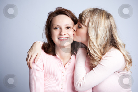 To use this stock image in your creative project, please select the size you need over to the right and click the "Add to Cart" button.
Your downloaded image will come with the Cutcaster watermark removed so don’t worry about the watermark you see on this page. Mother and daughter stock photo, A portrait of a happy mother and daughter by Suprijono Suharjoto