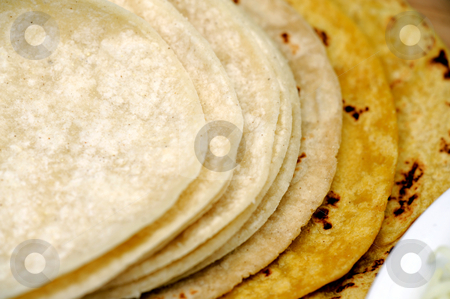 To use this stock image in your creative project, please select the size you need over to the right and click the "Add to Cart" button.
Your downloaded image will come with the Cutcaster watermark removed so don’t worry about the watermark you see on this page. Yellow and White Corn Tortillas stock photo, White and yellow corn tortillas close-up by Lynn Bendickson
