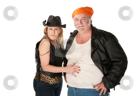 To use this stock image in your creative project, please select the size you need over to the right and click the "Add to Cart" button.
Your downloaded image will come with the Cutcaster watermark removed so don’t worry about the watermark you see on this page. Woman touching a big belly on her male friend or husband stock photo, Woman in leopard skin cowgirl outfit flirting with big bellied man by Scott Griessel