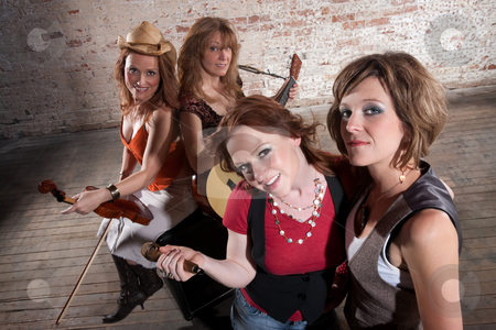 To use this stock image in your creative project, please select the size you need over to the right and click the "Add to Cart" button.
Your downloaded image will come with the Cutcaster watermark removed so don’t worry about the watermark you see on this page. Female musicians stock photo, All-Female band members gathering before a performance by Scott Griessel