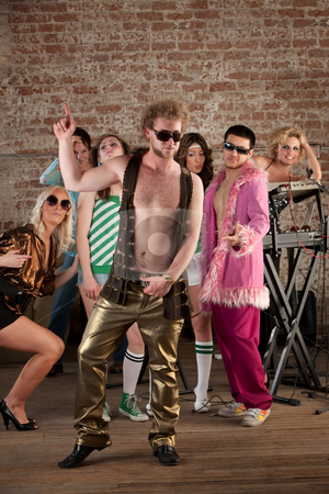To use this stock image in your creative project, please select the size you need over to the right and click the "Add to Cart" button.
Your downloaded image will come with the Cutcaster watermark removed so don’t worry about the watermark you see on this page. 1970s Disco Music Party stock photo, Dancing man with sunglasses at a 1970s Disco Music Party by Scott Griessel