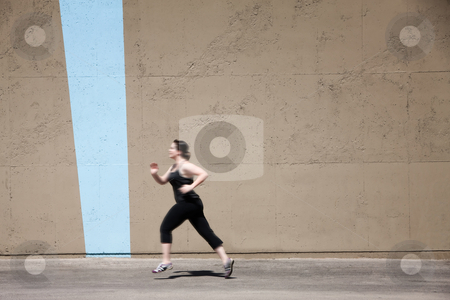 To use this stock image in your creative project, please select the size you need over to the right and click the "Add to Cart" button.
Your downloaded image will come with the Cutcaster watermark removed so don’t worry about the watermark you see on this page. Single woman runs to get in shape stock photo, Woman runs as part of her fitness program. by Scott Griessel