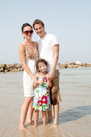To use this stock image in your creative project, please select the size you need over to the right and click the "Add to Cart" button.
Your downloaded image will come with the Cutcaster watermark removed so don’t worry about the watermark you see on this page. Family on the beach stock photo, Young family standing with young daughter in the beach by Get4net