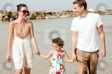 To use this stock image in your creative project, please select the size you need over to the right and click the "Add to Cart" button.
Your downloaded image will come with the Cutcaster watermark removed so don’t worry about the watermark you see on this page. Happy family stock photo, Young couple embracing and enjoying with young daughter in the beach by Get4net