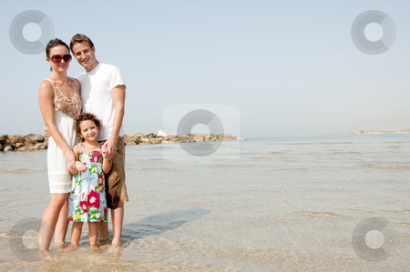 To use this stock image in your creative project, please select the size you need over to the right and click the "Add to Cart" button.
Your downloaded image will come with the Cutcaster watermark removed so don’t worry about the watermark you see on this page. Family on the beach stock photo, Young family standing with young daughter in the beach by Get4net